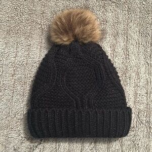Black hand knitted women’s beanie OS with brownish  puff ball on top